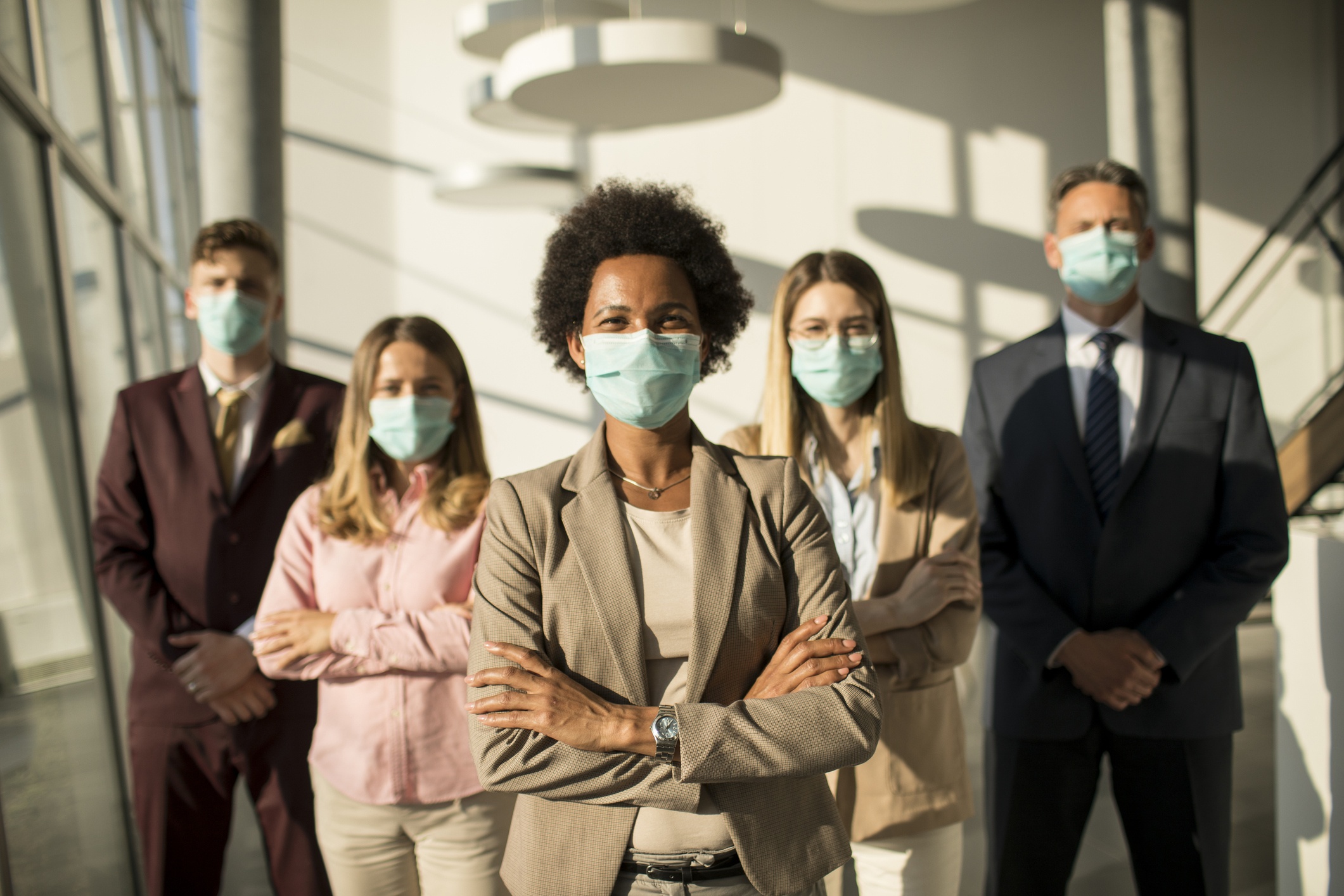Group of people with facemasks showing leadership, image of new podcast episode about personal agency, collective action and the new normal with Paul Napper & Aaron Dignan